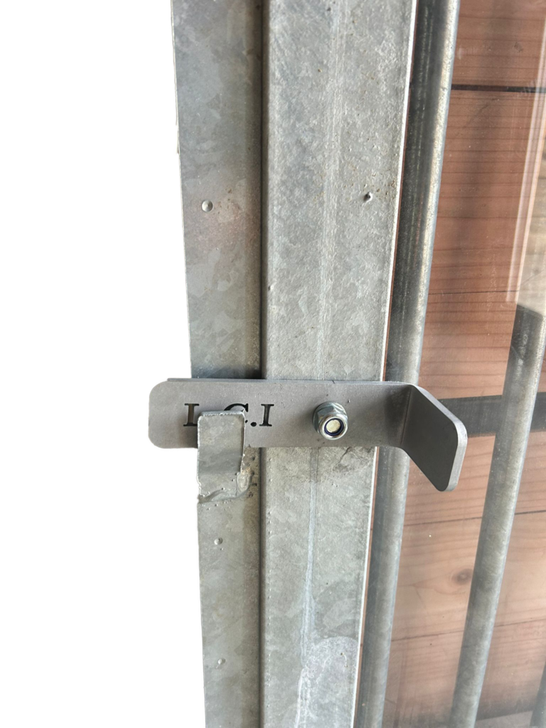 Close-Up of Steel Bars and Plexiglas on an External Stable Window