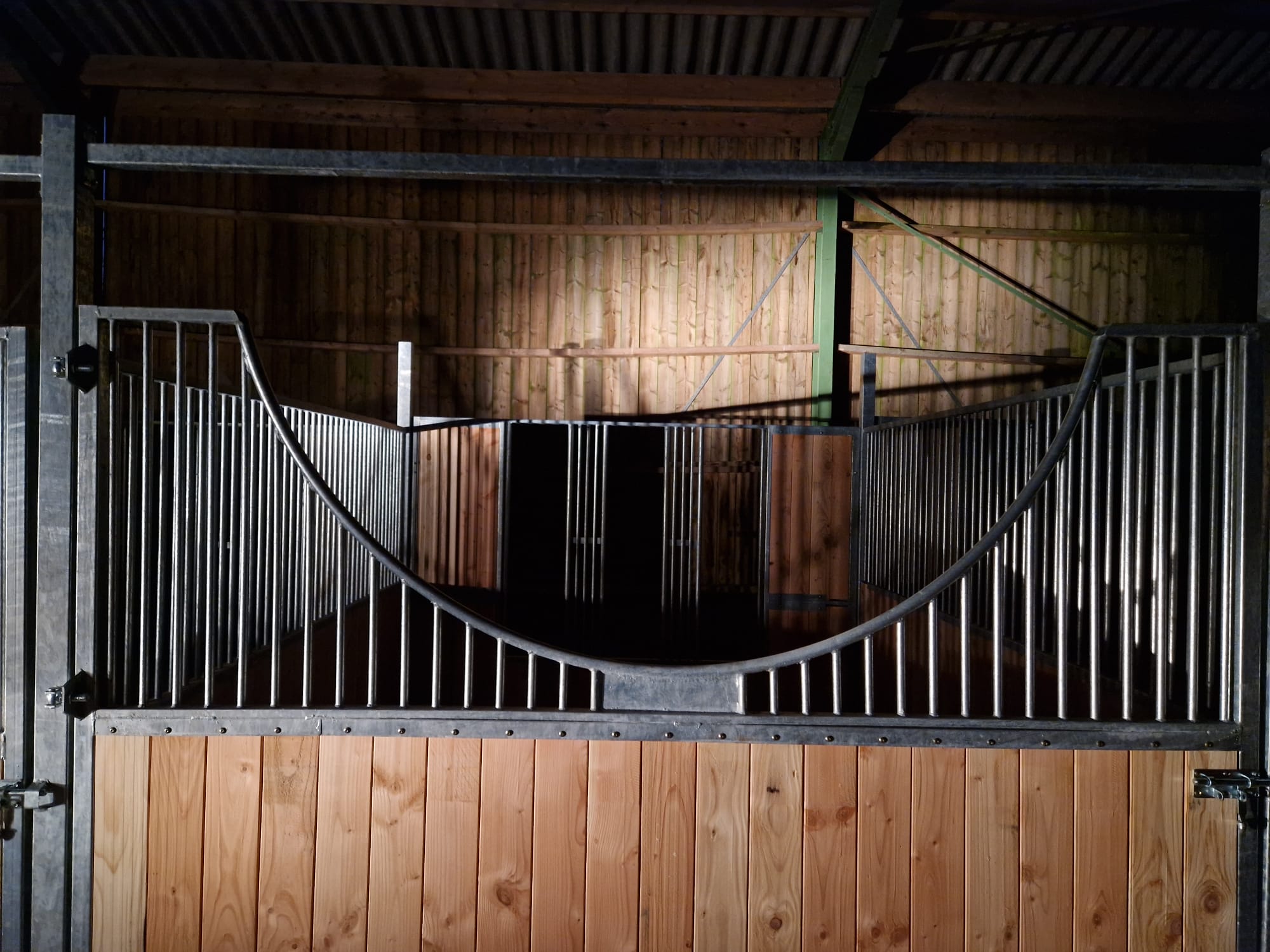 "Semi-circular stable front with full-opening door, ideal for mechanical mucking-out of stables"