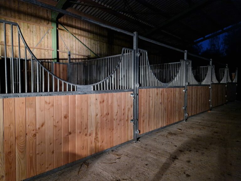 "Semi-circular stable front with full-opening door, ideal for mechanical mucking-out of stables"